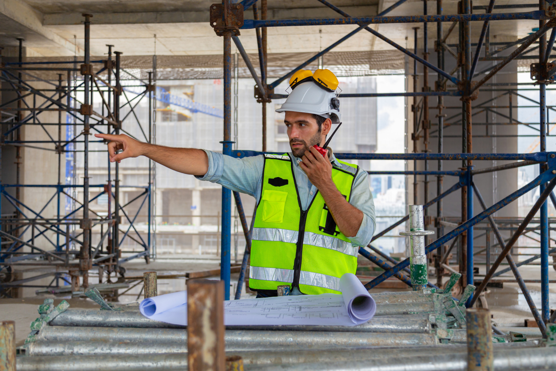 Portrait of an engineer designing a large project inspecting the job site to meet specifications.