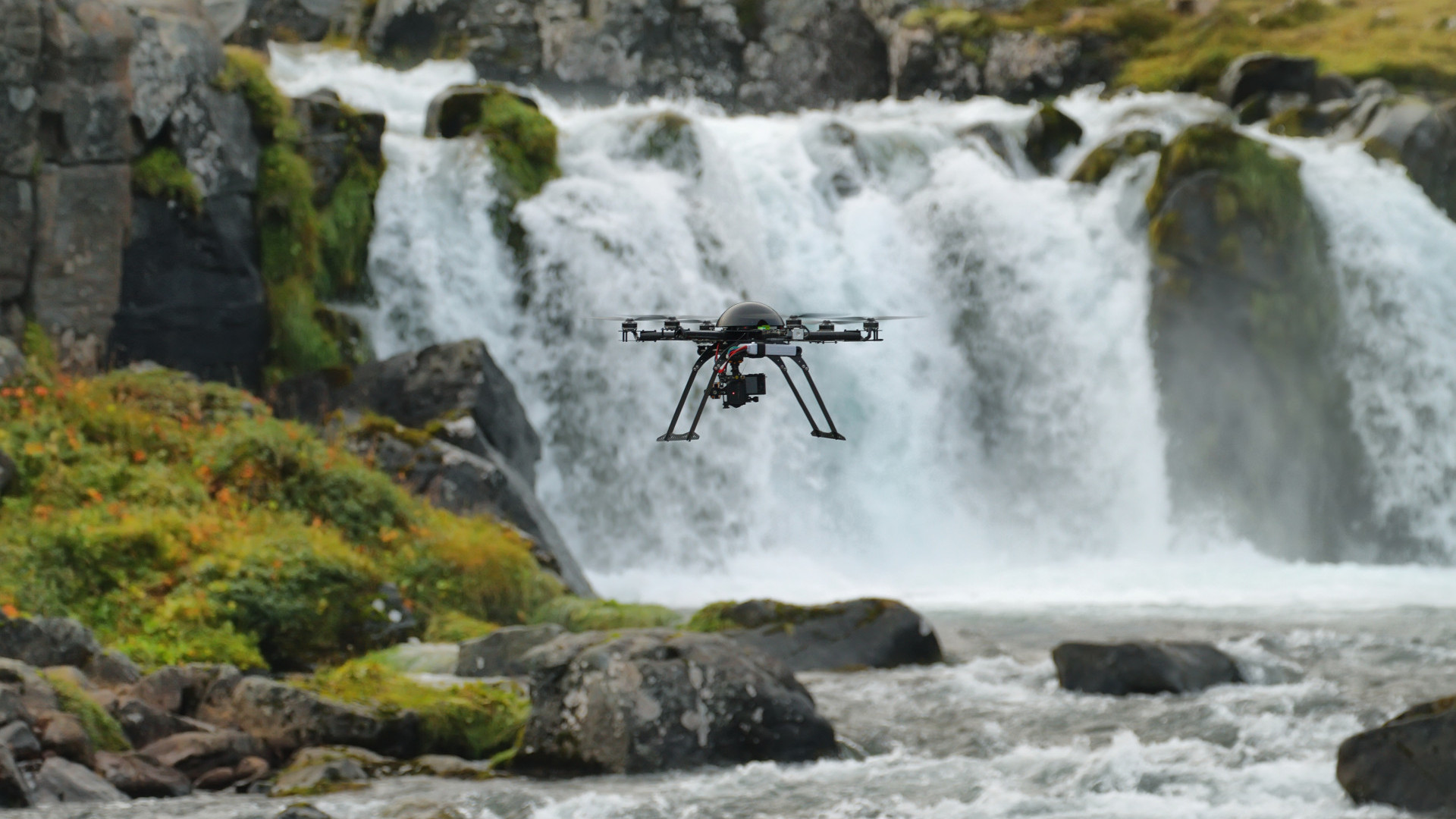Little quadcopter flying around Dynjandi waterfall in Westfjords, Iceland